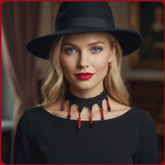Blond model with black hat and black dress wearing a coral and crystal silk necklace